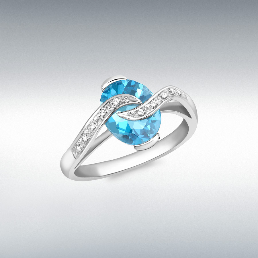 18ct White Gold 0.04ct Diamond and Oval Blue Topaz Ring