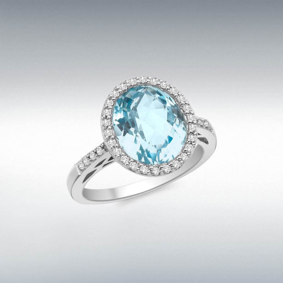 9ct White Gold 0.23ct Diamond and Oval Blue Topaz 12mm x 13mm Ring